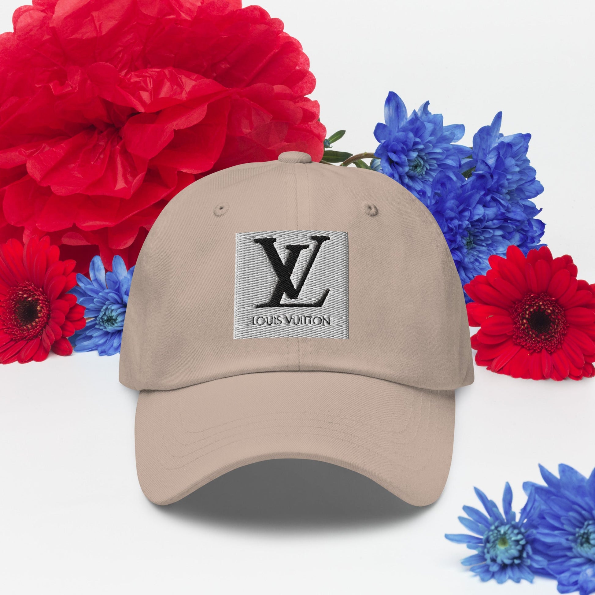 Beige dad hat with adjustable strap and curved visor.