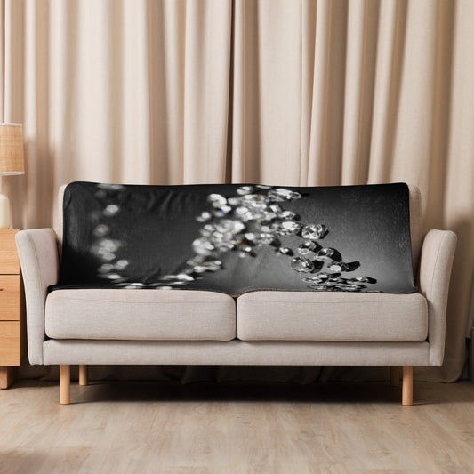 Sherpa blanket on sofa, adding warmth and cozy style.