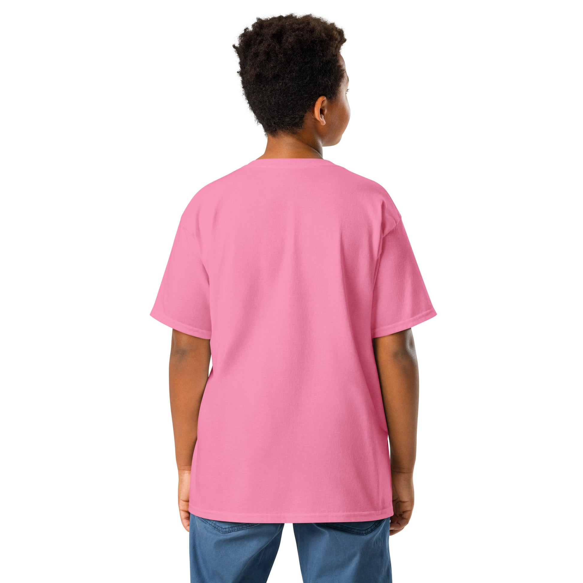 Boy wearing a pink JW bear Youth classic tee, showcasing its classic fit and quality cotton fabric.